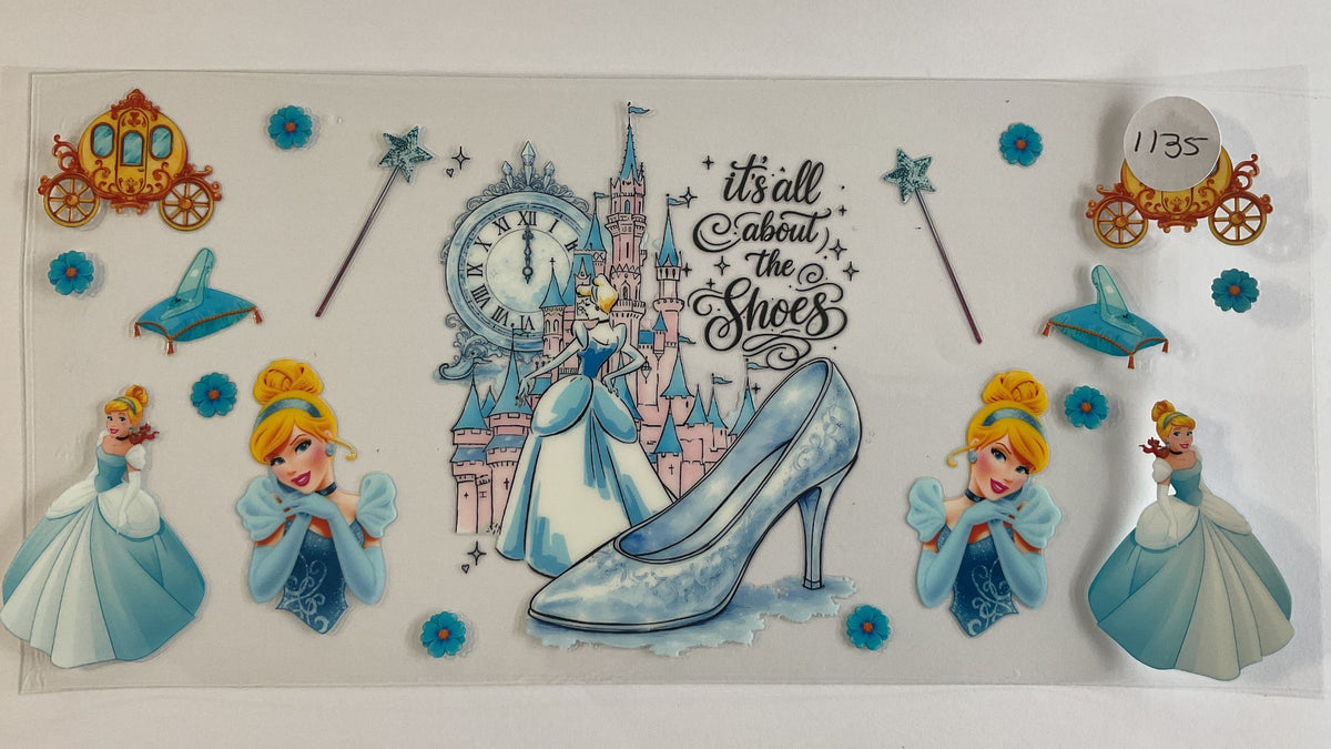 A sheet of Disney Princess-themed decorative stickers or decals on a white background, featuring Cinderella, Cinderella Jr., castles, a glass slipper, carriages, wands, and the phrase 'it's all about the Shoes'.